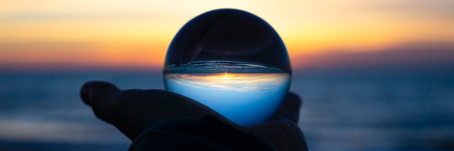 person holding clear glass glass